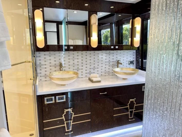 a bathroom with sinks and mirrors aboard OBSESSION Yacht for Sale