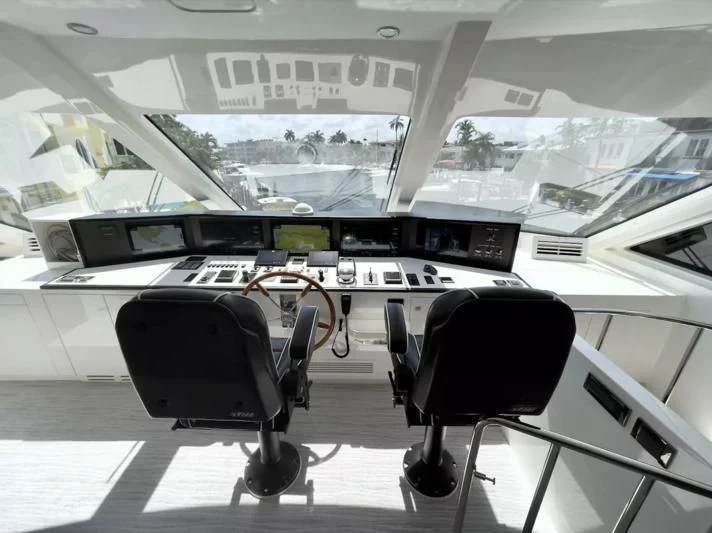 a black chair in front of a white keyboard and a black chair aboard OBSESSION Yacht for Sale