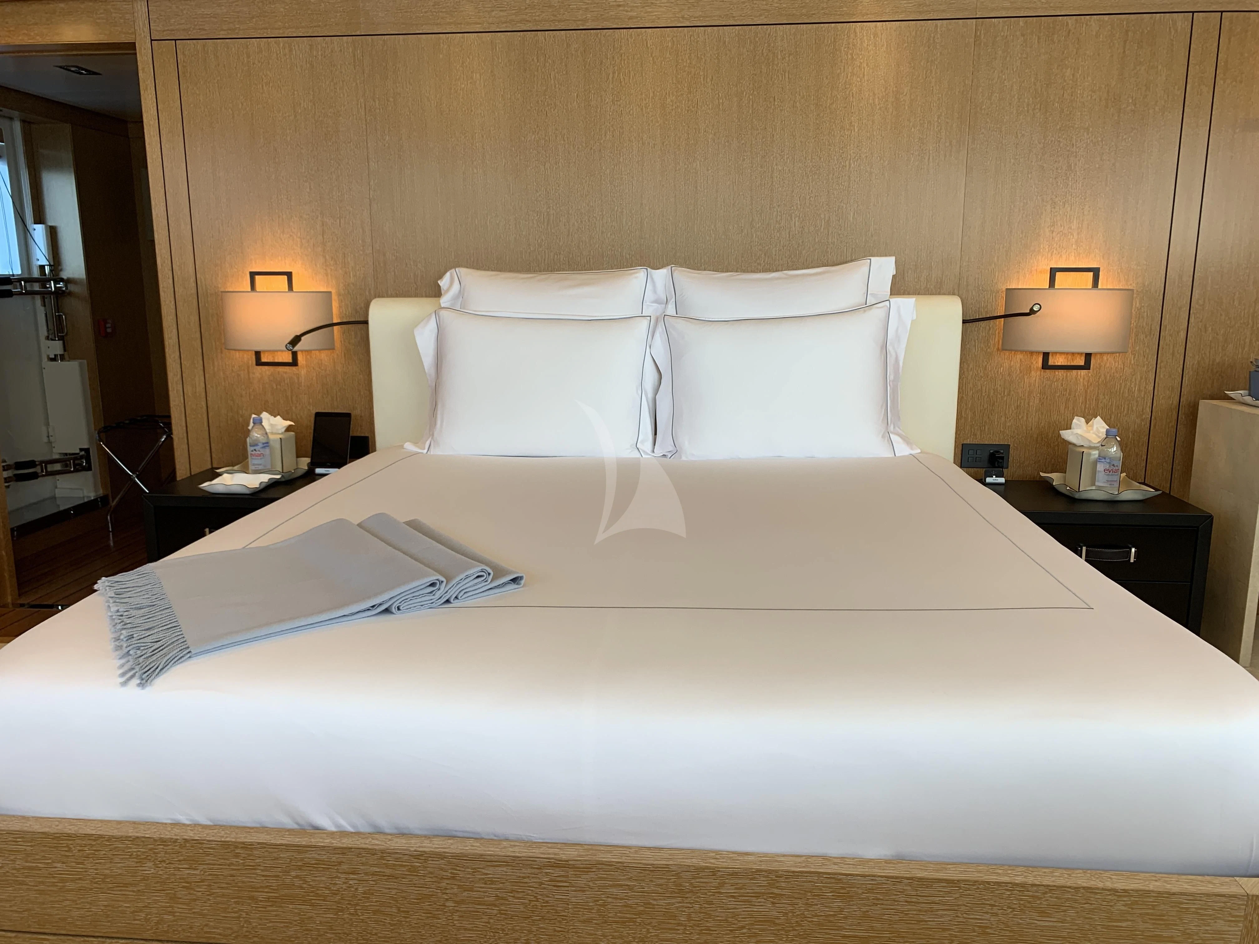 a bed with white sheets aboard BELONGERS Yacht for Sale