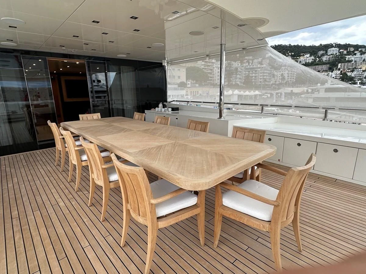 a table and chairs in a room aboard BELONGERS Yacht for Sale