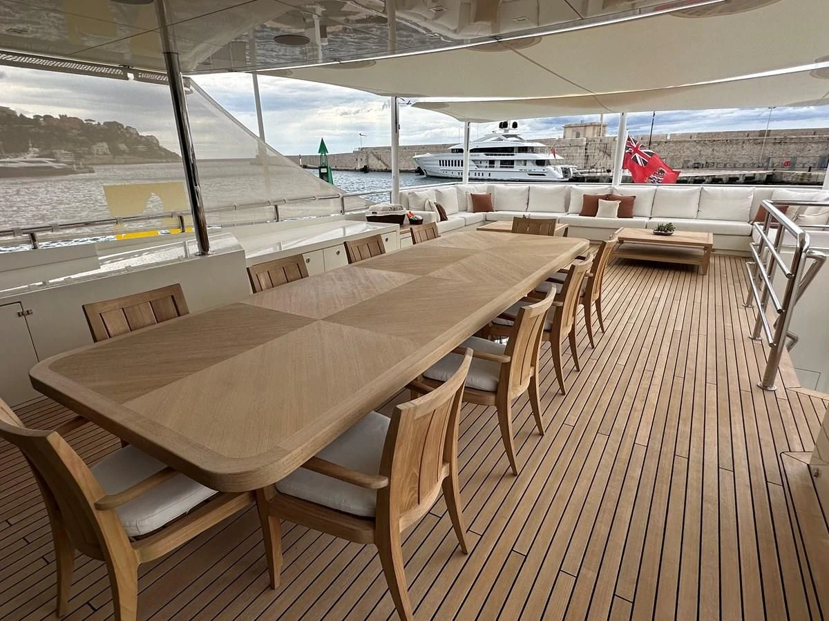 a room with a table and chairs aboard BELONGERS Yacht for Sale