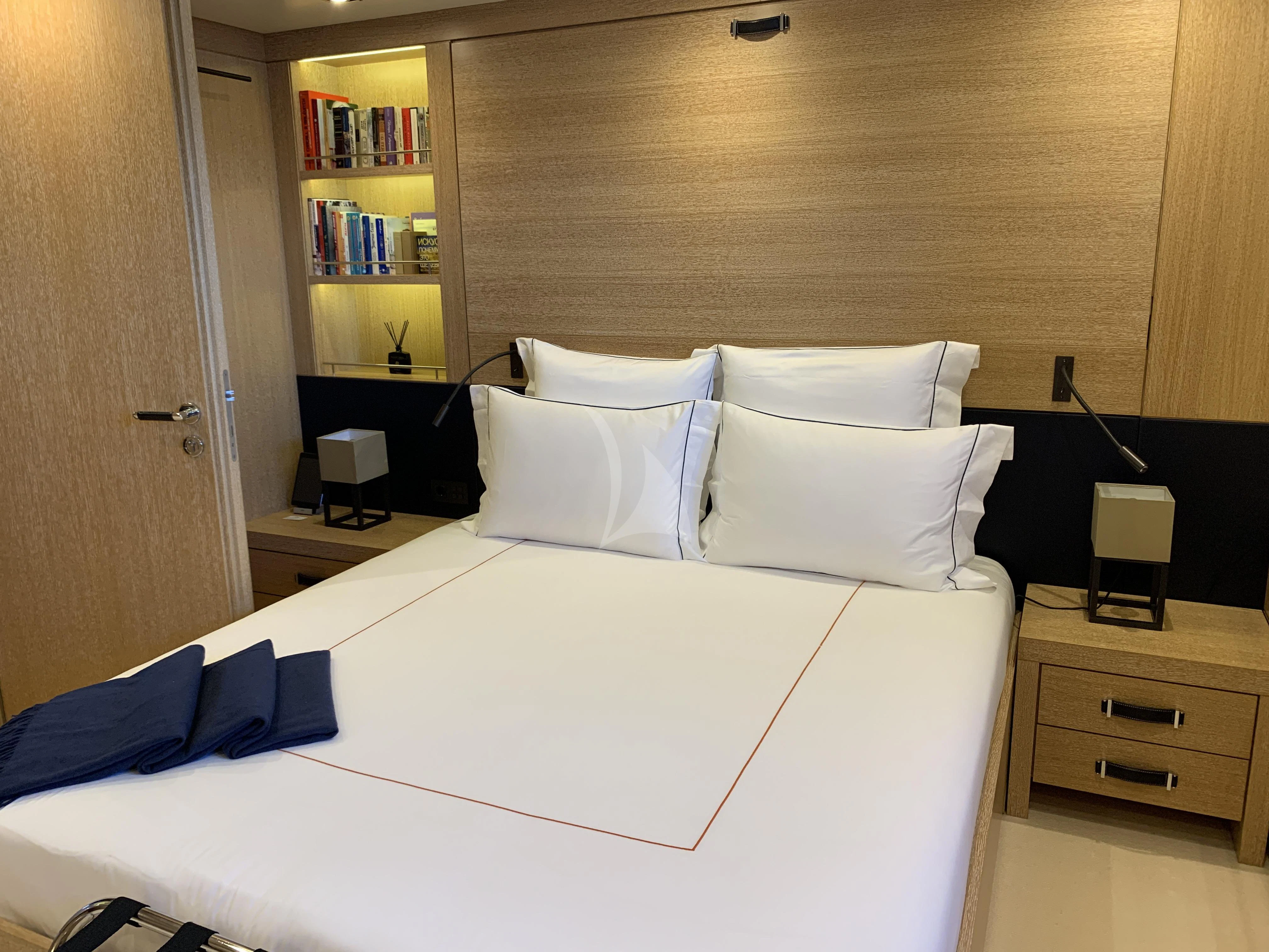 a bed with white sheets aboard BELONGERS Yacht for Sale