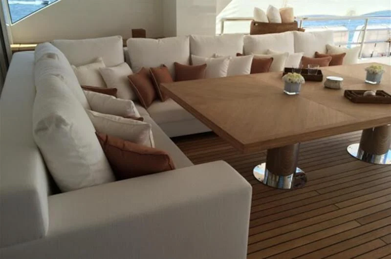 a living room with a couch and a table aboard BELONGERS Yacht for Sale