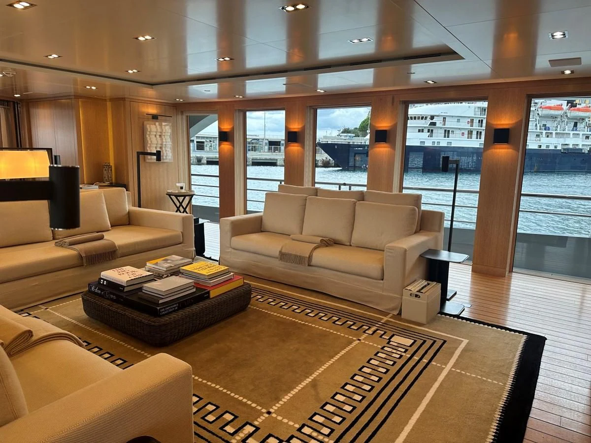a living room with a large window aboard BELONGERS Yacht for Sale