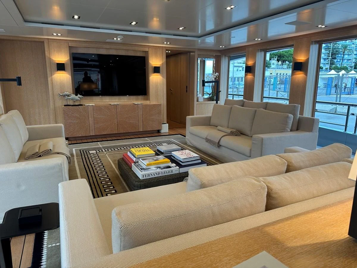 a living room with a couch and a tv aboard BELONGERS Yacht for Sale