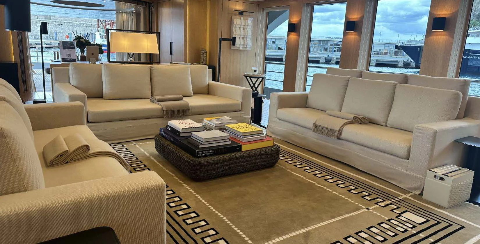 a living room with a couch and a coffee table aboard BELONGERS Yacht for Sale