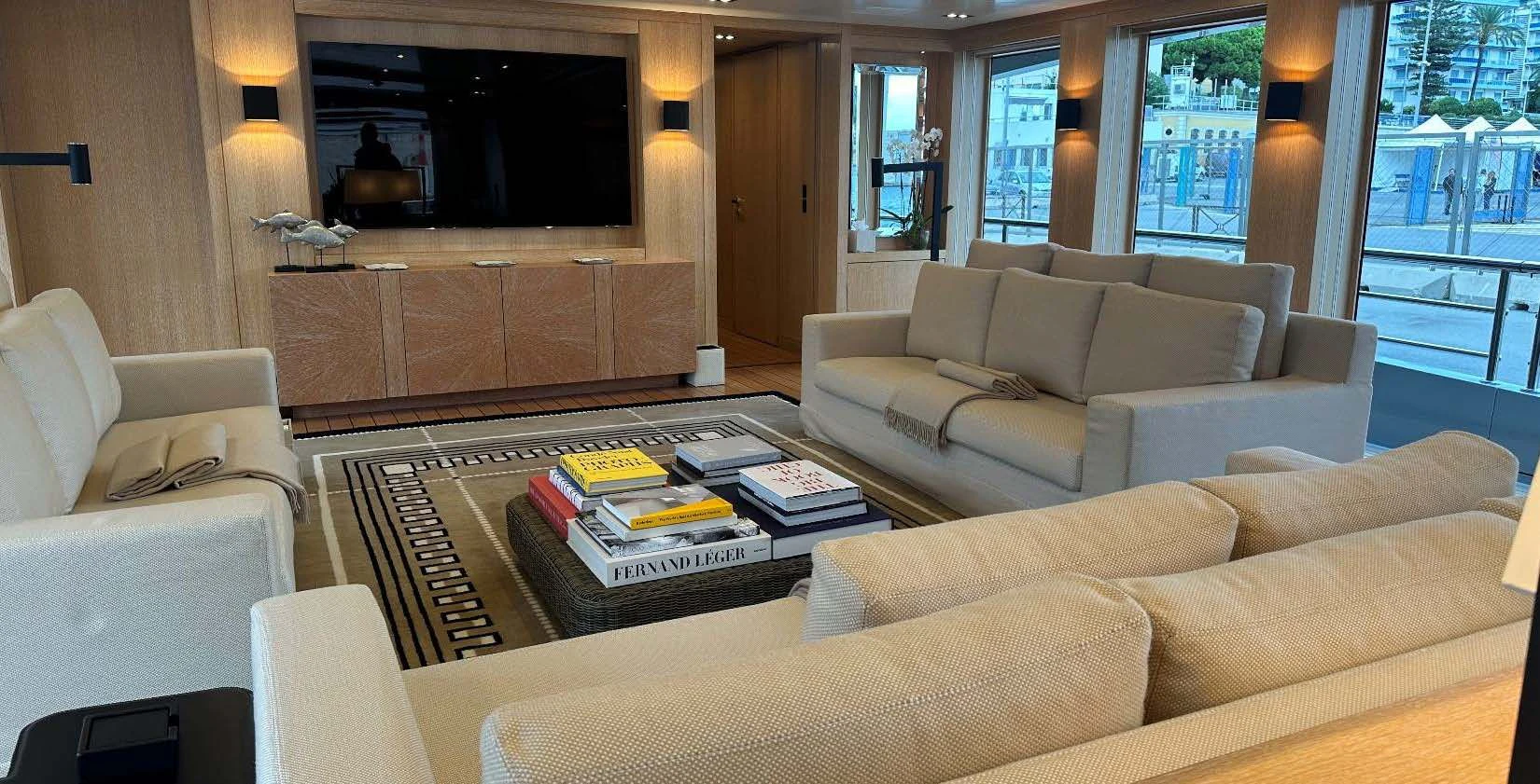 a living room with a fireplace aboard BELONGERS Yacht for Sale