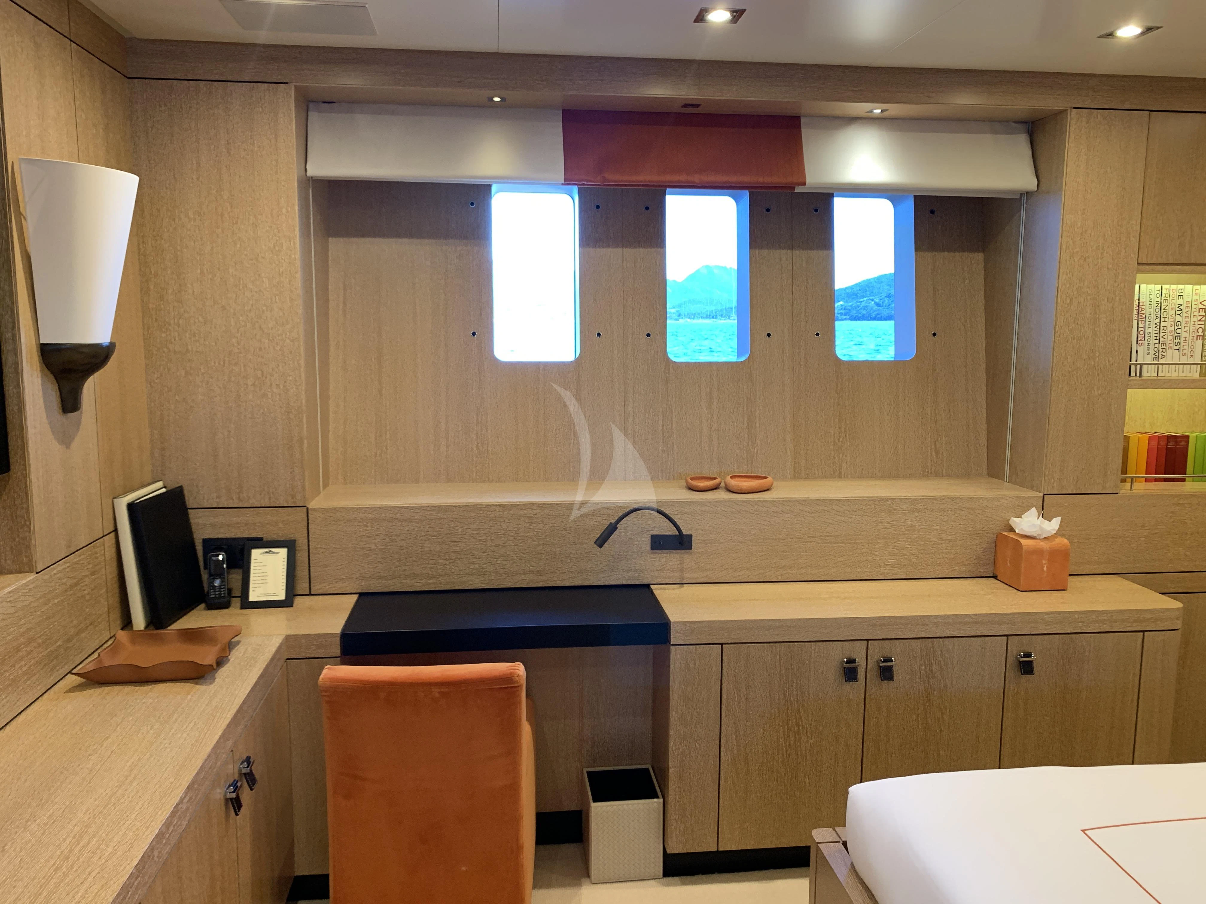 a room with a desk and computer aboard BELONGERS Yacht for Sale