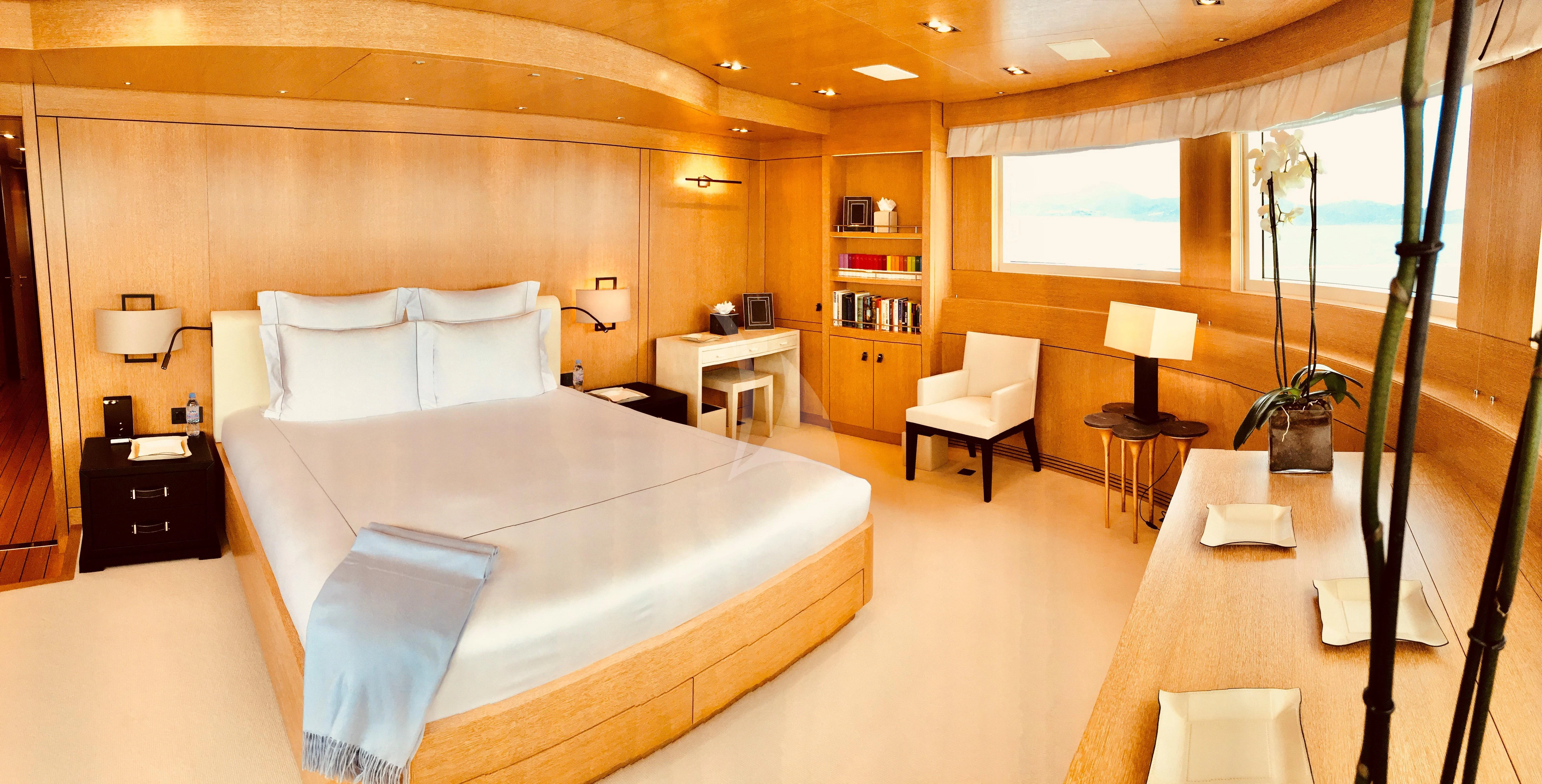 a room with a bed and a desk aboard BELONGERS Yacht for Sale