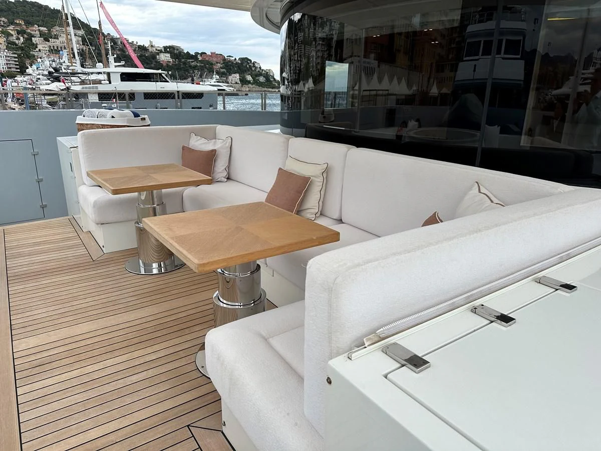 a room with a table and chairs aboard BELONGERS Yacht for Sale