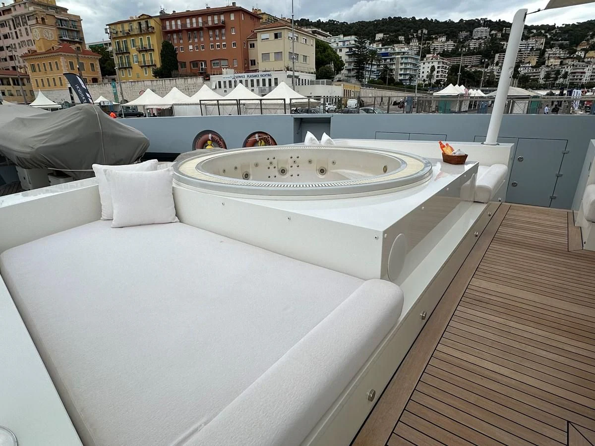 a white bed on a deck aboard BELONGERS Yacht for Sale