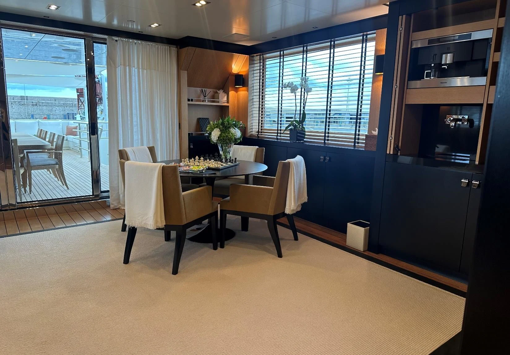 a room with a table and chairs aboard BELONGERS Yacht for Sale
