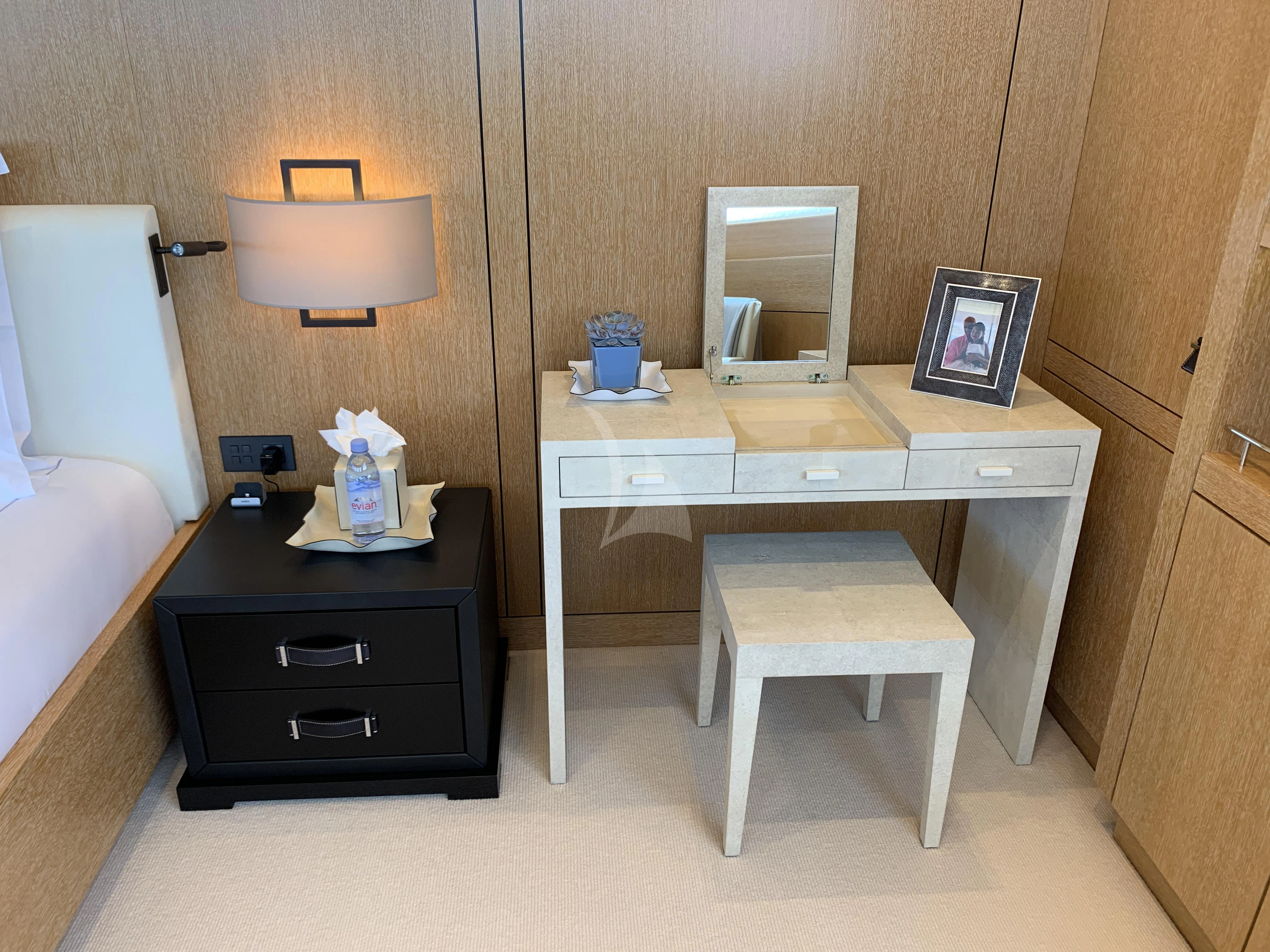 a small bathroom with a mirror and a dresser aboard BELONGERS Yacht for Sale