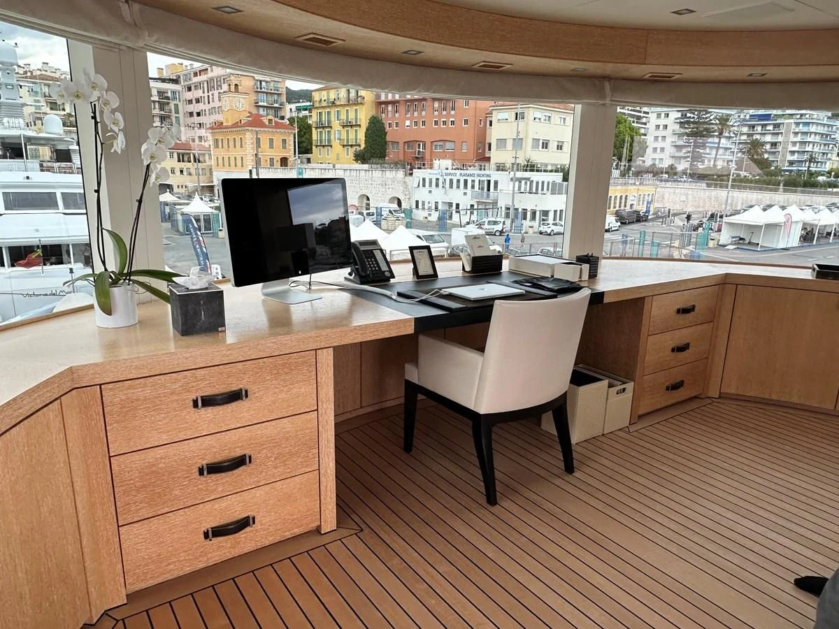 a room with a desk and computer aboard BELONGERS Yacht for Sale