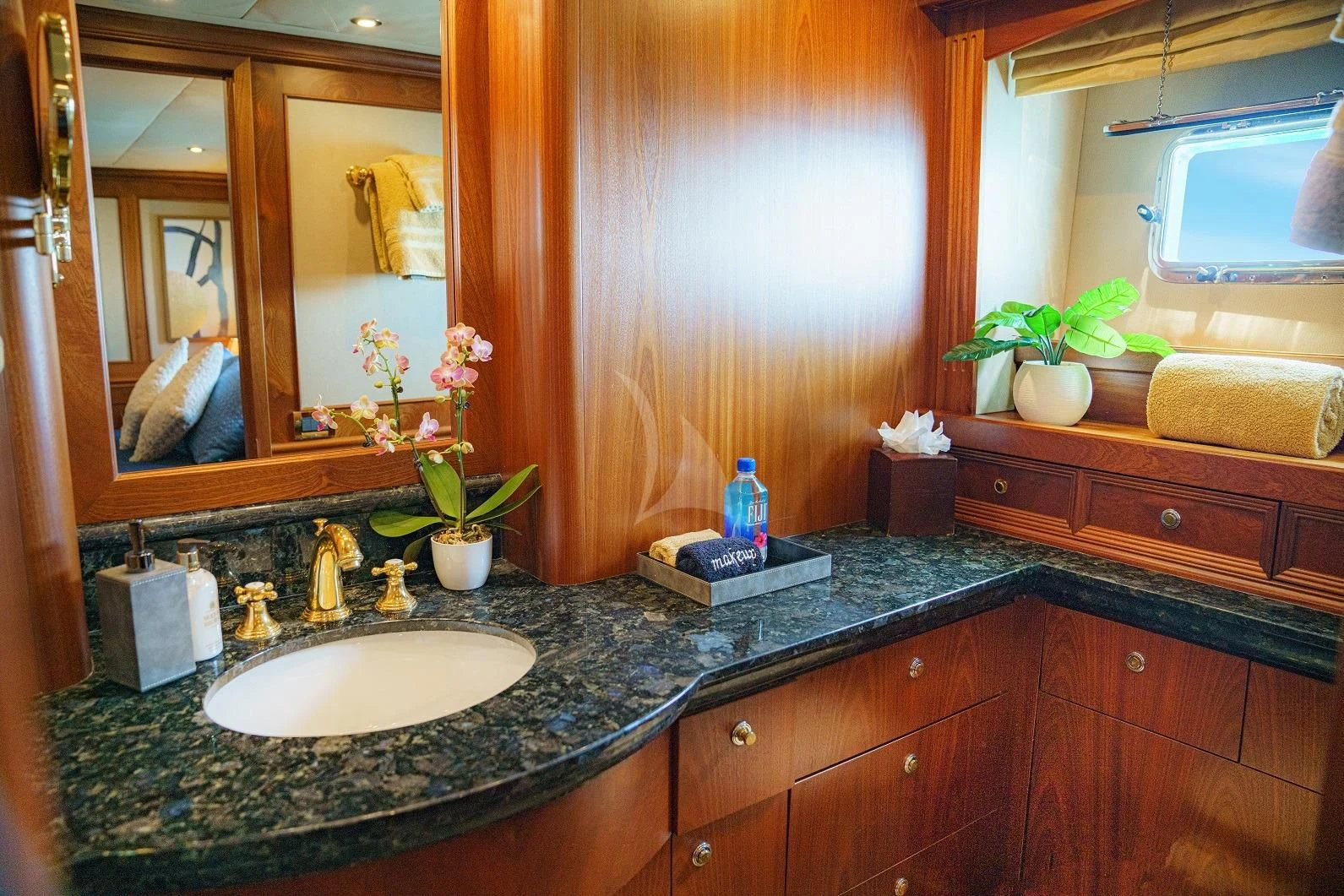 a bathroom with a sink and a mirror aboard LADY VICTORY Yacht for Sale