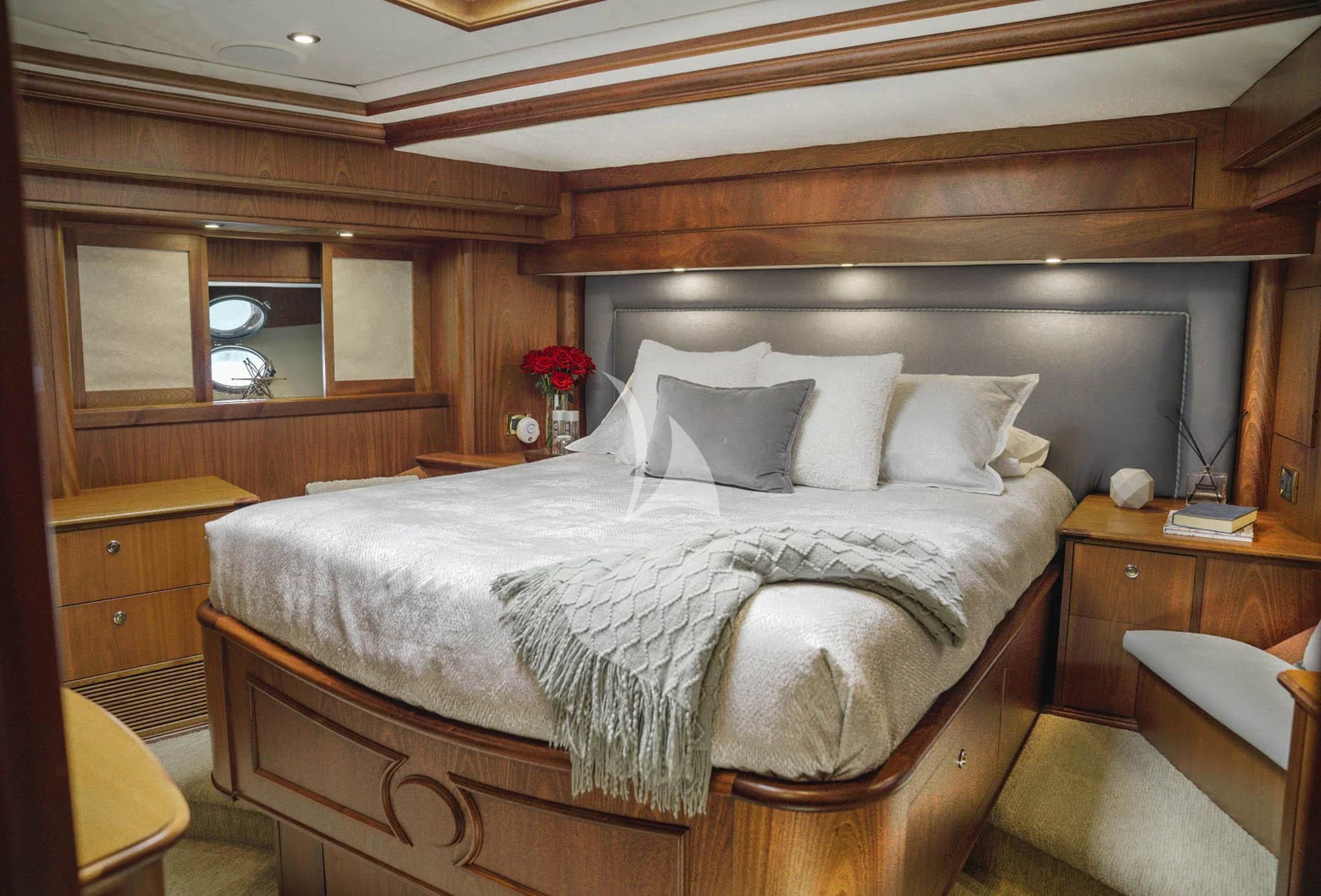 a bed with white sheets and pillows aboard LADY VICTORY Yacht for Sale