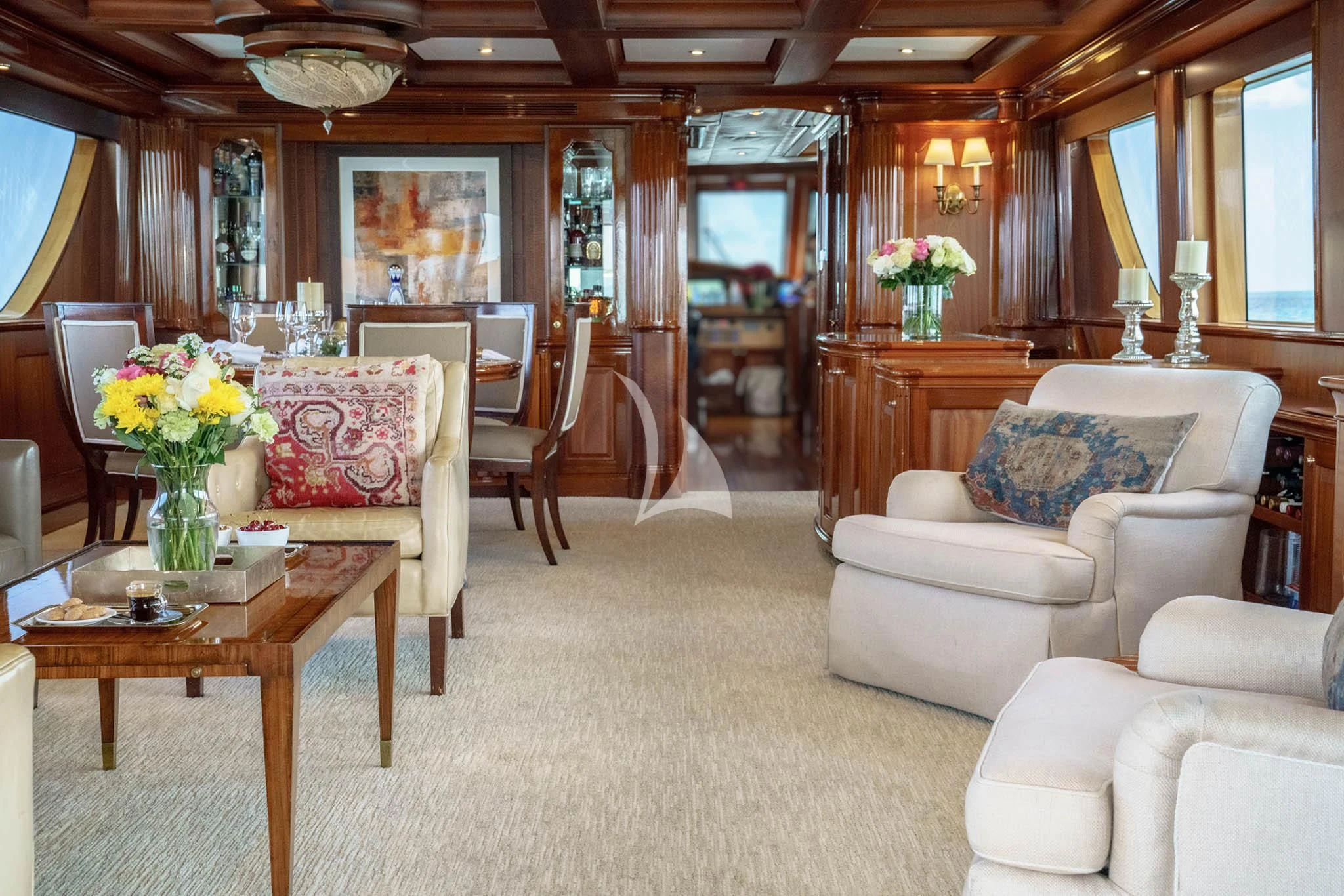 a living room with a table and chairs aboard LADY VICTORY Yacht for Sale