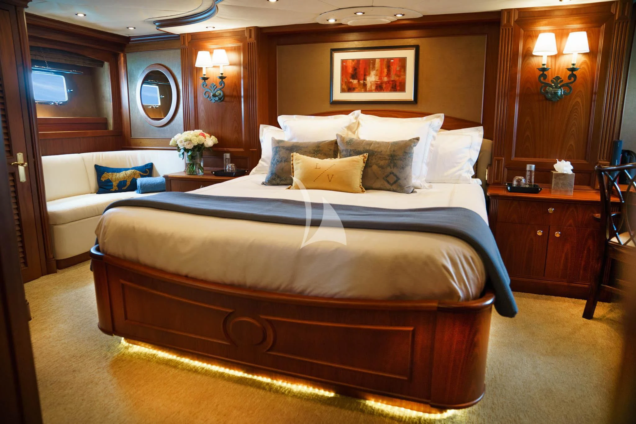 a bed with a blue comforter aboard LADY VICTORY Yacht for Sale