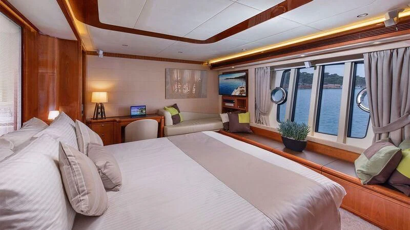 a large bed in a room aboard ANNOUKA TWINS Yacht for Sale