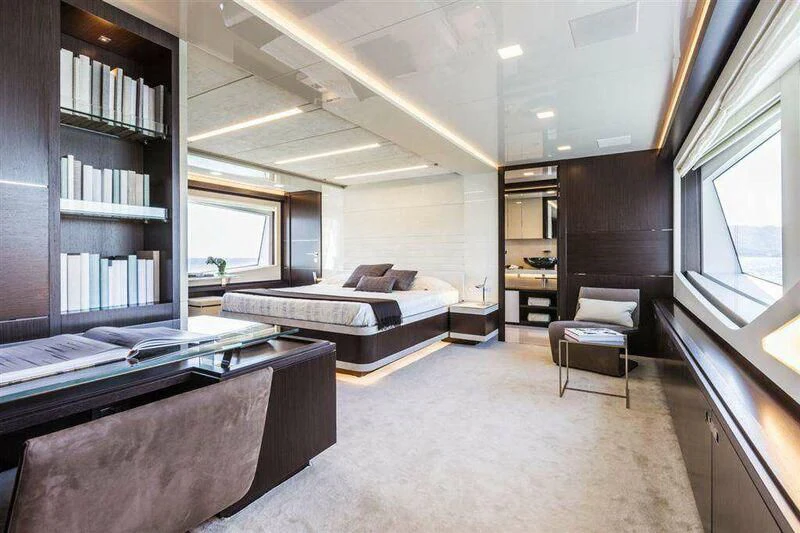 a room with a bed and a piano aboard MIKIL Yacht for Sale