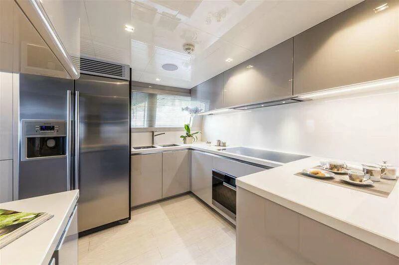 a kitchen with stainless steel appliances aboard MIKIL Yacht for Sale