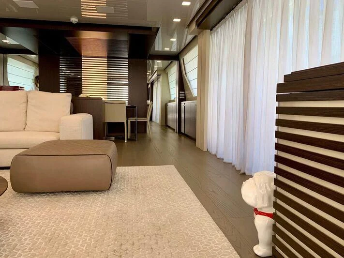 a room with a couch and a table and a chair aboard MIKIL Yacht for Sale