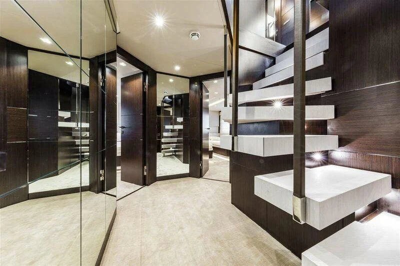a large room with a set of stairs aboard MIKIL Yacht for Sale