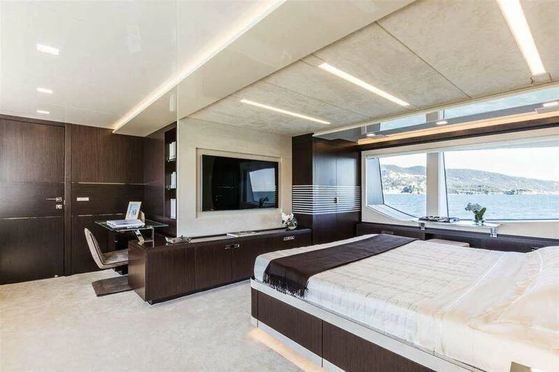 a room with a bed and a desk aboard MIKIL Yacht for Sale
