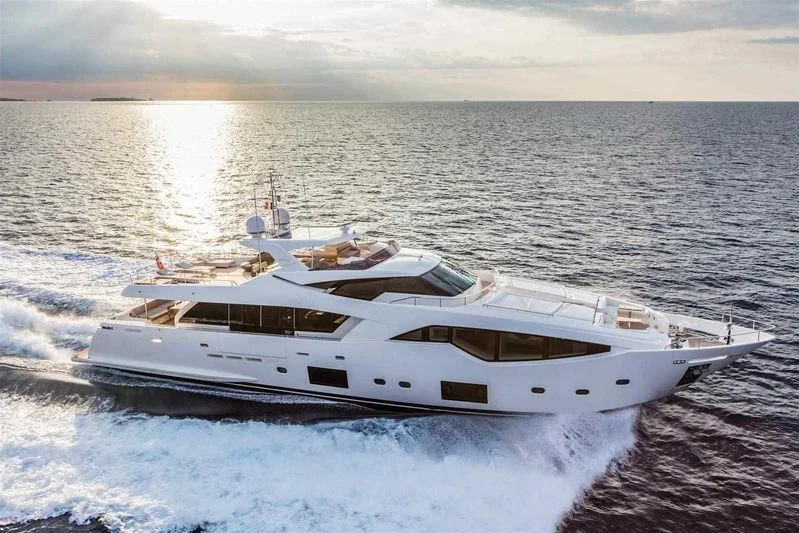 a white yacht on the water aboard MIKIL Yacht for Sale