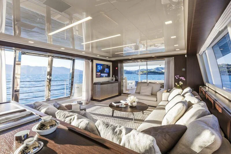 a living room with a large window aboard MIKIL Yacht for Sale