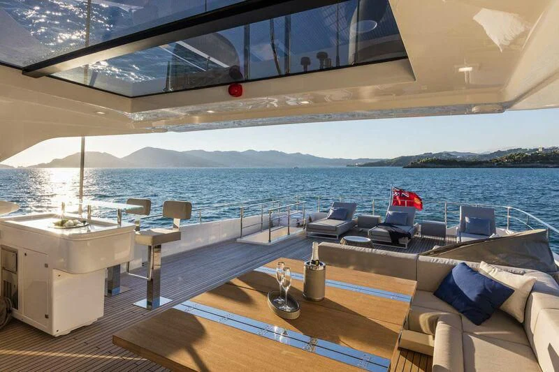 a room with a view of the ocean and a deck aboard MIKIL Yacht for Sale