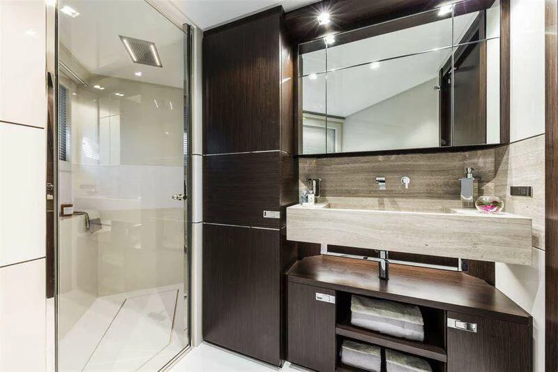 a bathroom with a large mirror aboard MIKIL Yacht for Sale