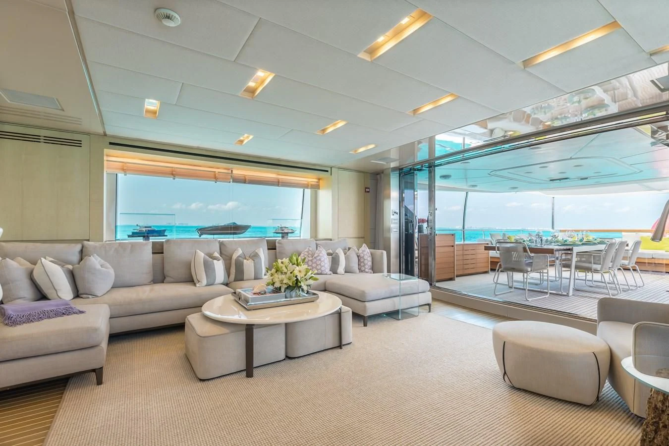 a living room with a couch and a table aboard TAKARA ONE Yacht for Charter