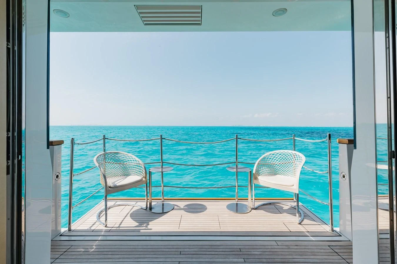 a deck with chairs and a chair on it aboard TAKARA ONE Yacht for Charter