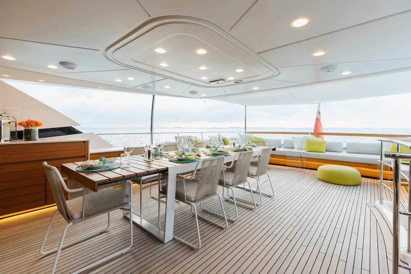 a large room with tables and chairs aboard TAKARA ONE Yacht for Charter