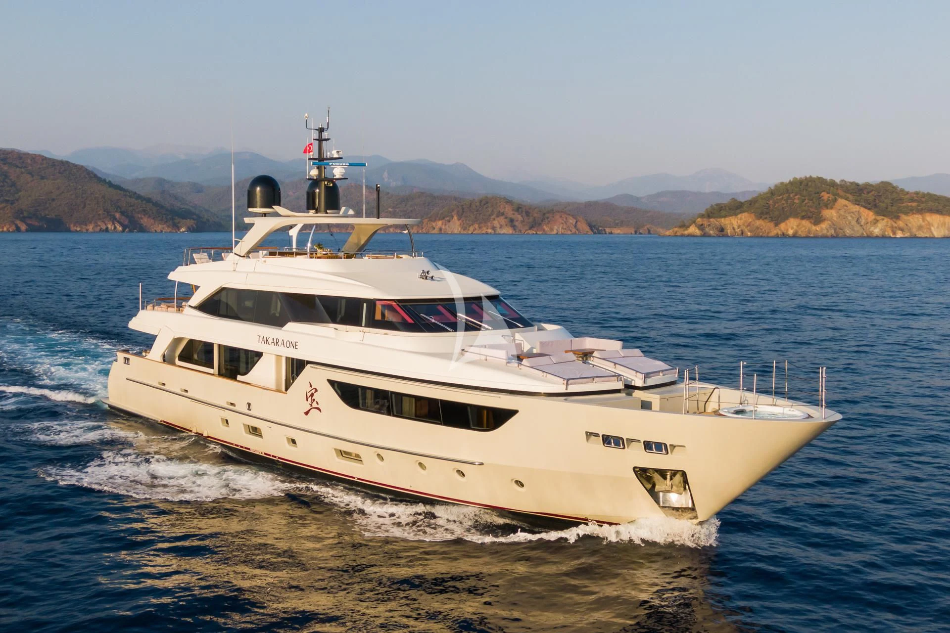 a white yacht on the water aboard TAKARA ONE Yacht for Charter