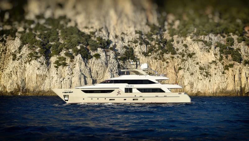 a white yacht on the water aboard TAKARA ONE Yacht for Charter