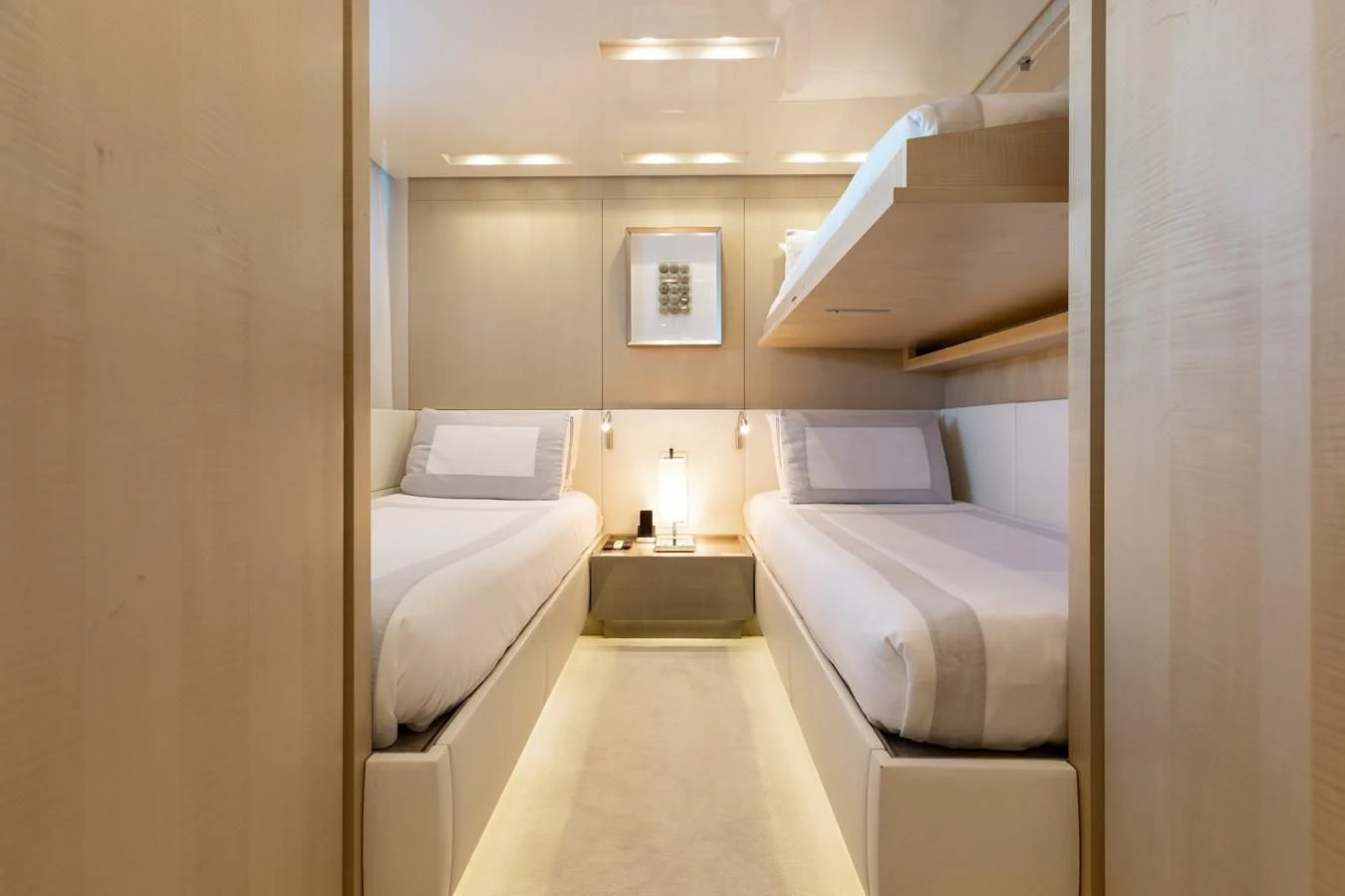 a room with a bed and a table aboard TAKARA ONE Yacht for Charter
