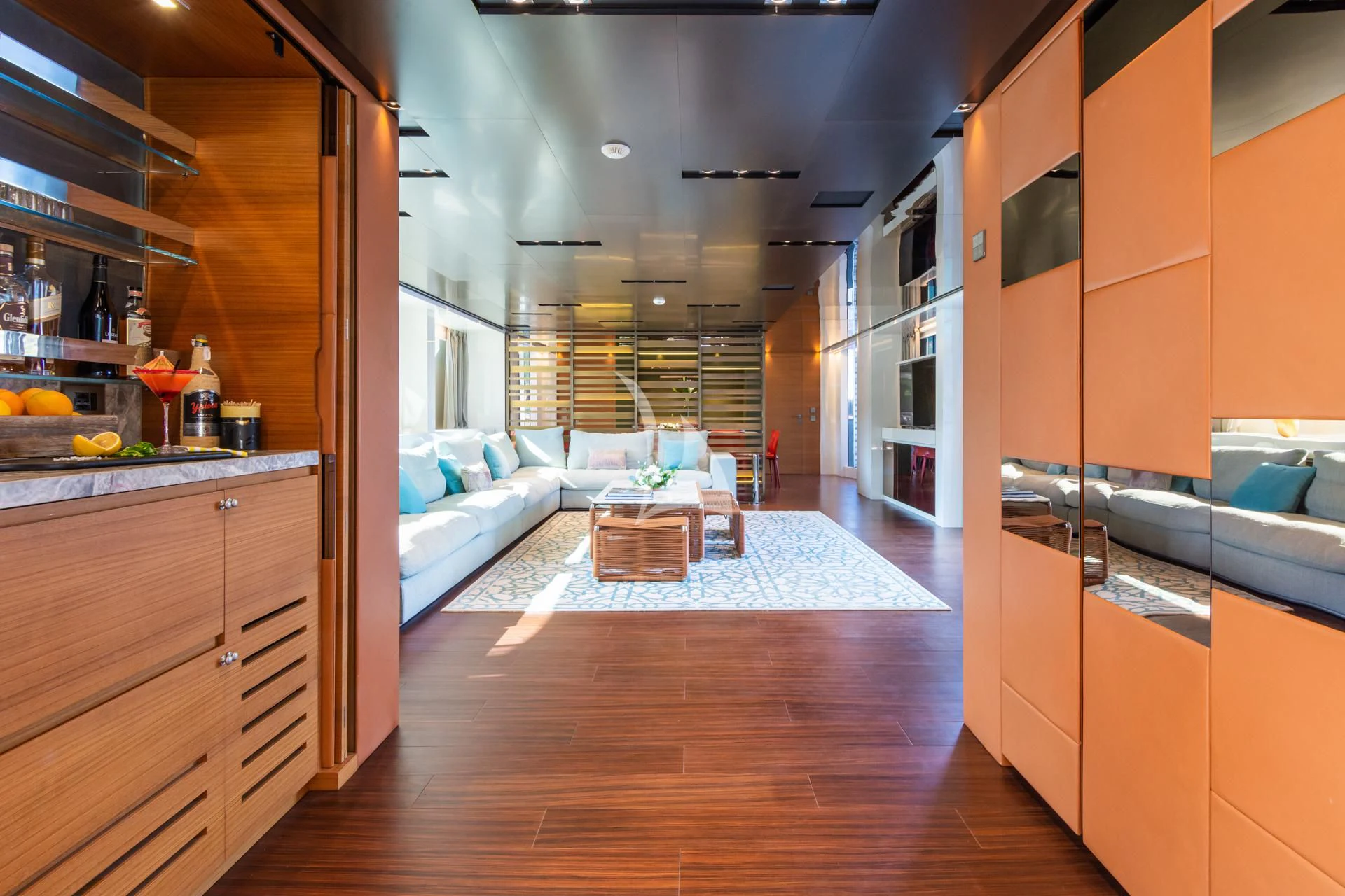 a room with a bed and a table aboard TAKARA ONE Yacht for Charter