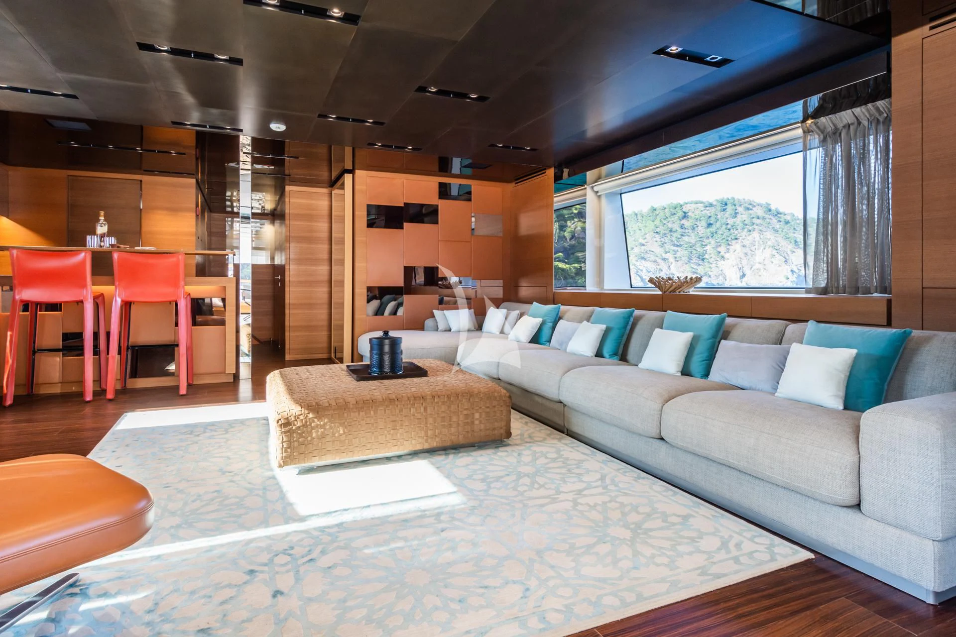 a living room with a couch and a table aboard TAKARA ONE Yacht for Charter