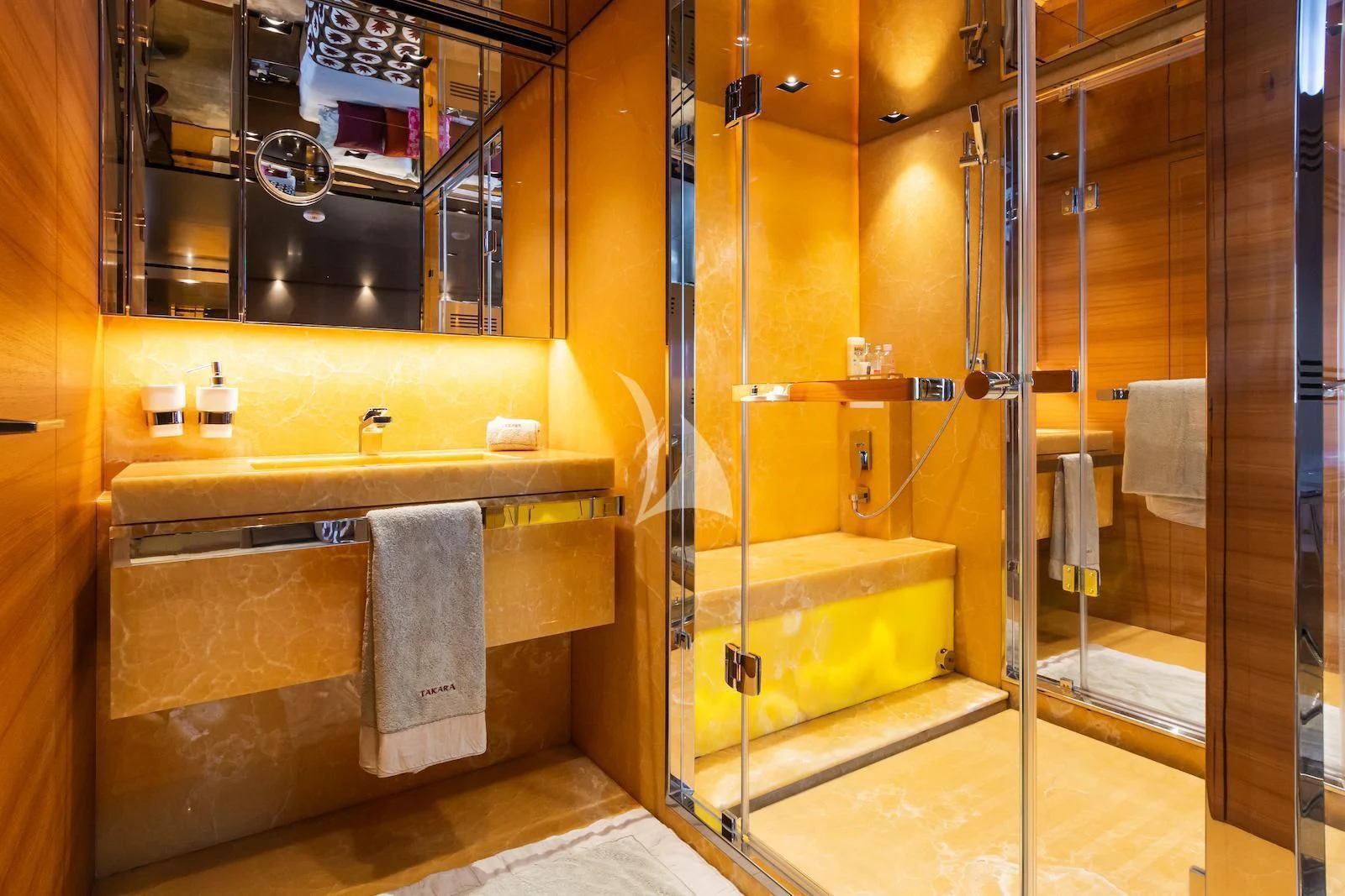 a bathroom with a glass shower aboard TAKARA ONE Yacht for Charter