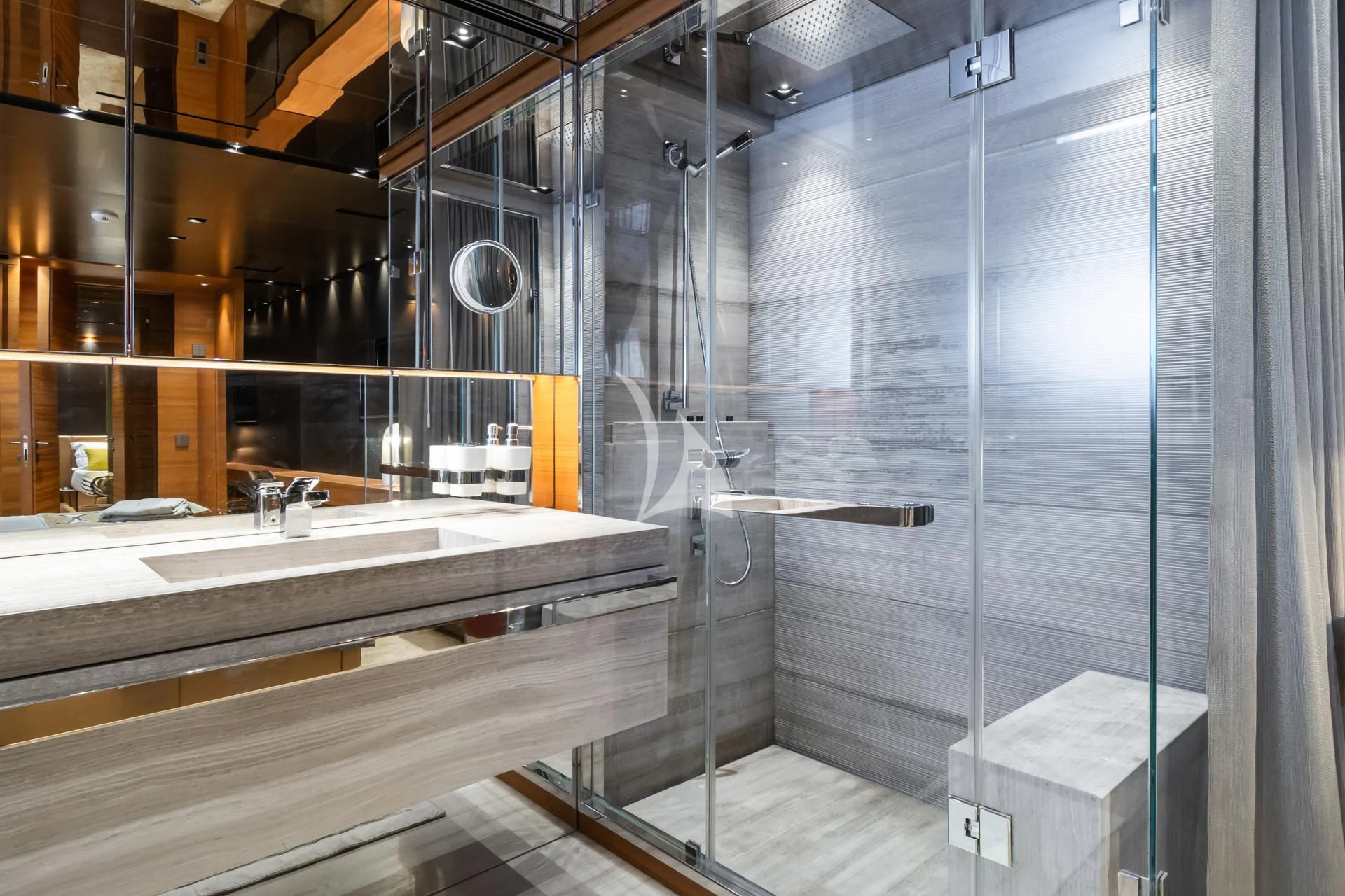 a bathroom with a glass shower aboard TAKARA ONE Yacht for Charter