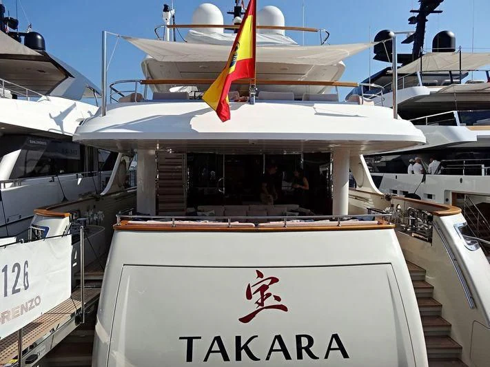 a boat with a sail on the deck aboard TAKARA ONE Yacht for Charter