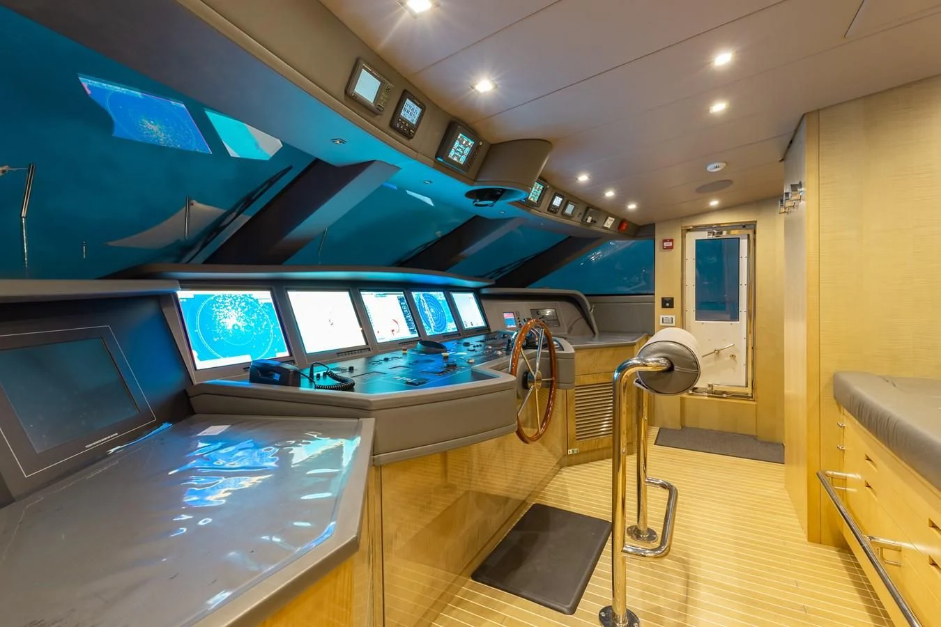 a room with a large window and a large pool table aboard TAKARA ONE Yacht for Charter