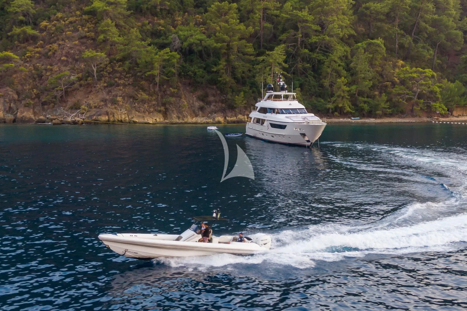 a boat sailing on the water aboard TAKARA ONE Yacht for Charter