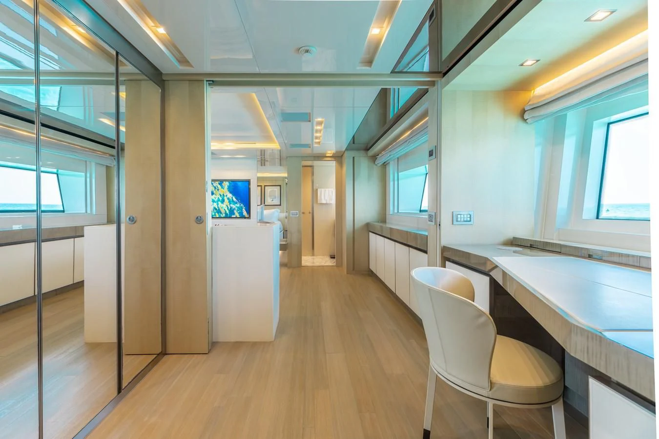 a long hallway with a counter and chairs aboard TAKARA ONE Yacht for Charter