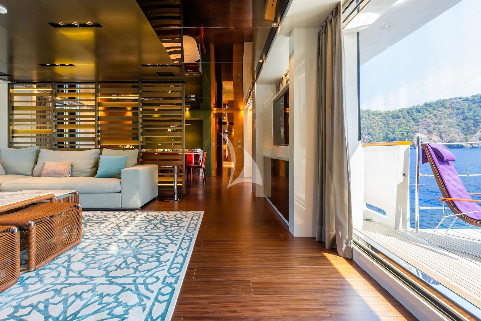 a living room with a large window aboard TAKARA ONE Yacht for Charter
