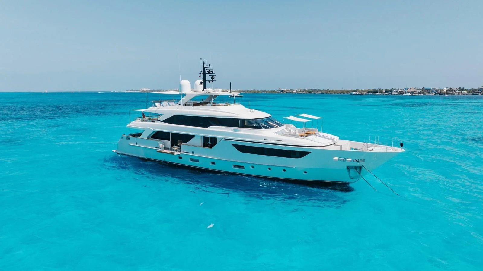 a white boat in the water aboard TAKARA ONE Yacht for Charter