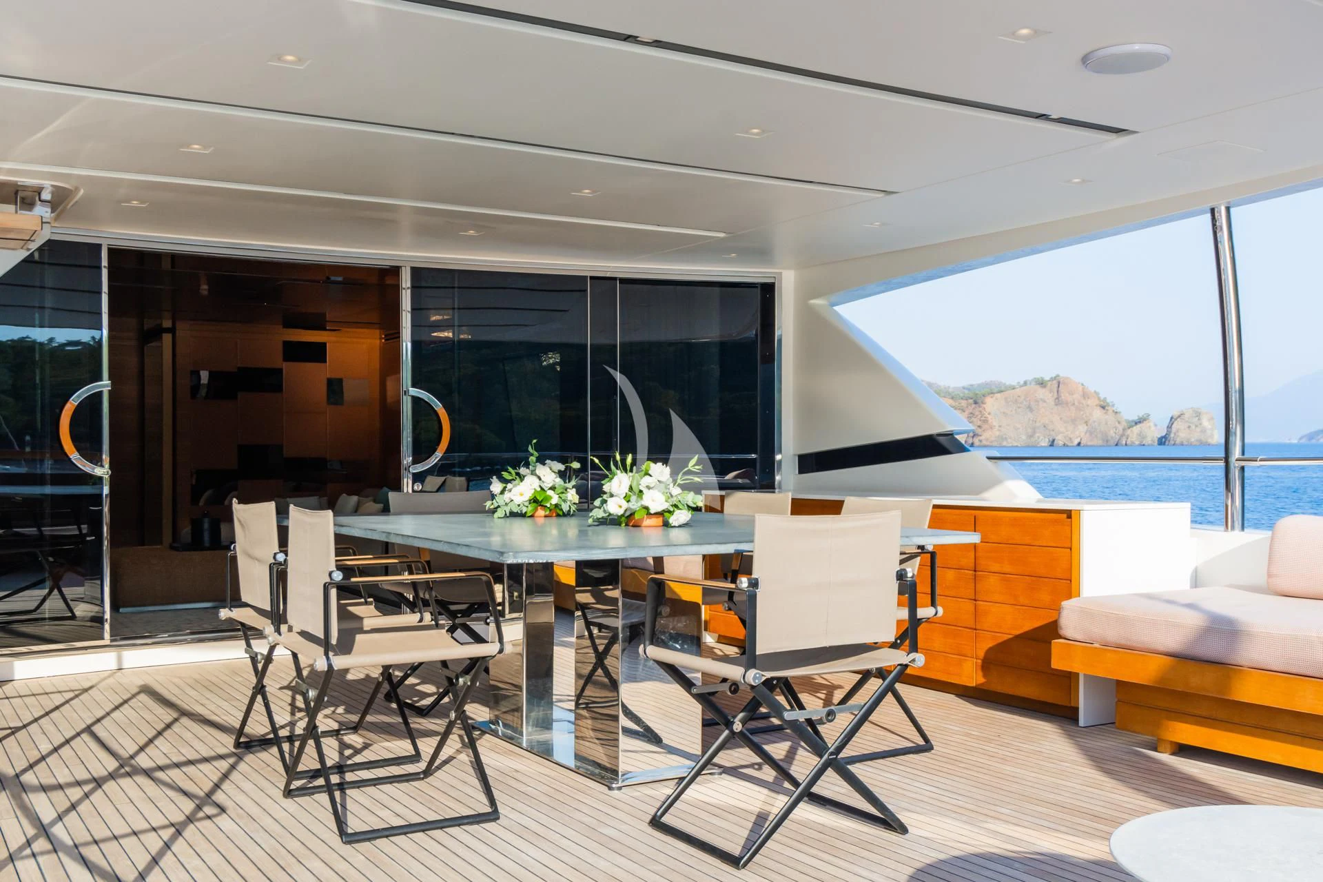 a room with a table and chairs aboard TAKARA ONE Yacht for Charter
