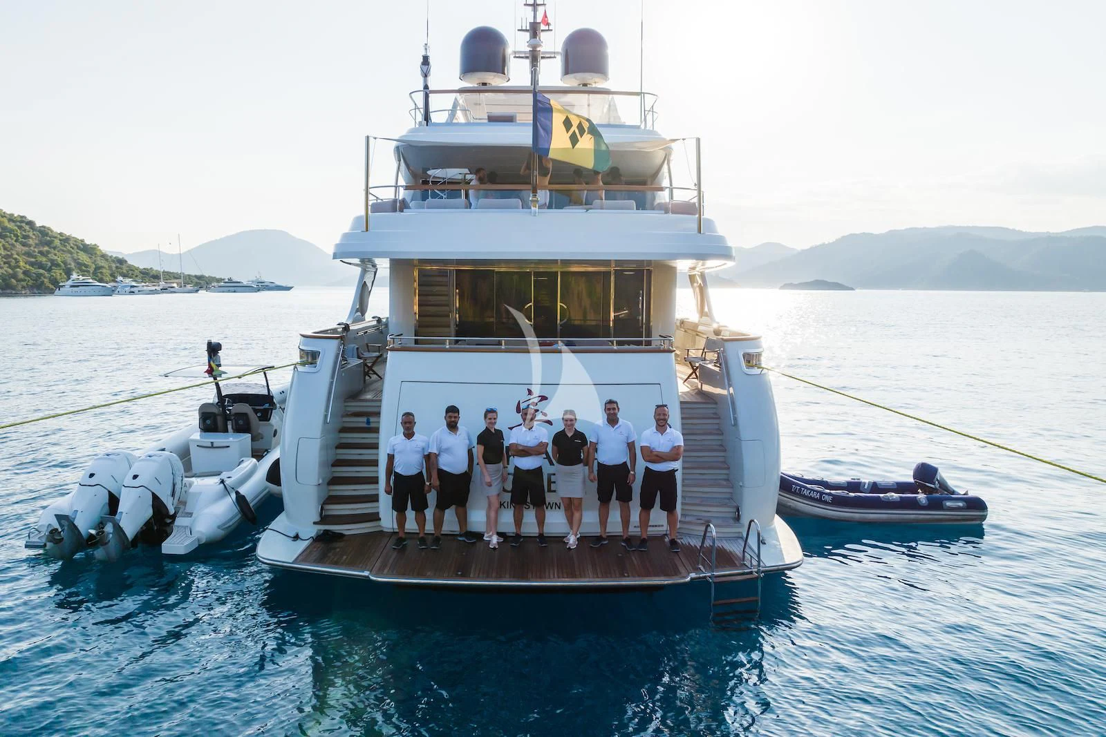 a group of people on a boat aboard TAKARA ONE Yacht for Charter